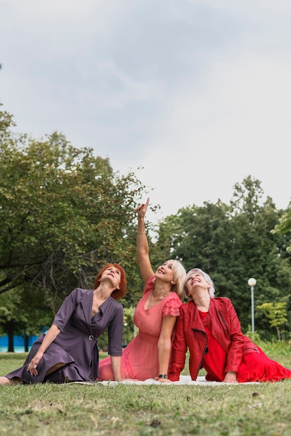 Elderly women celebrating friendship in the park