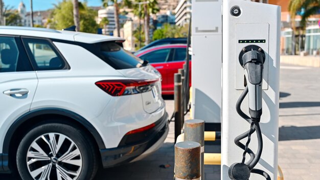 Electric car Audi Q5 charging at the charging station