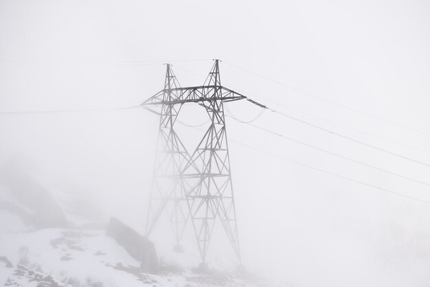 Electric pole on a foggy day
