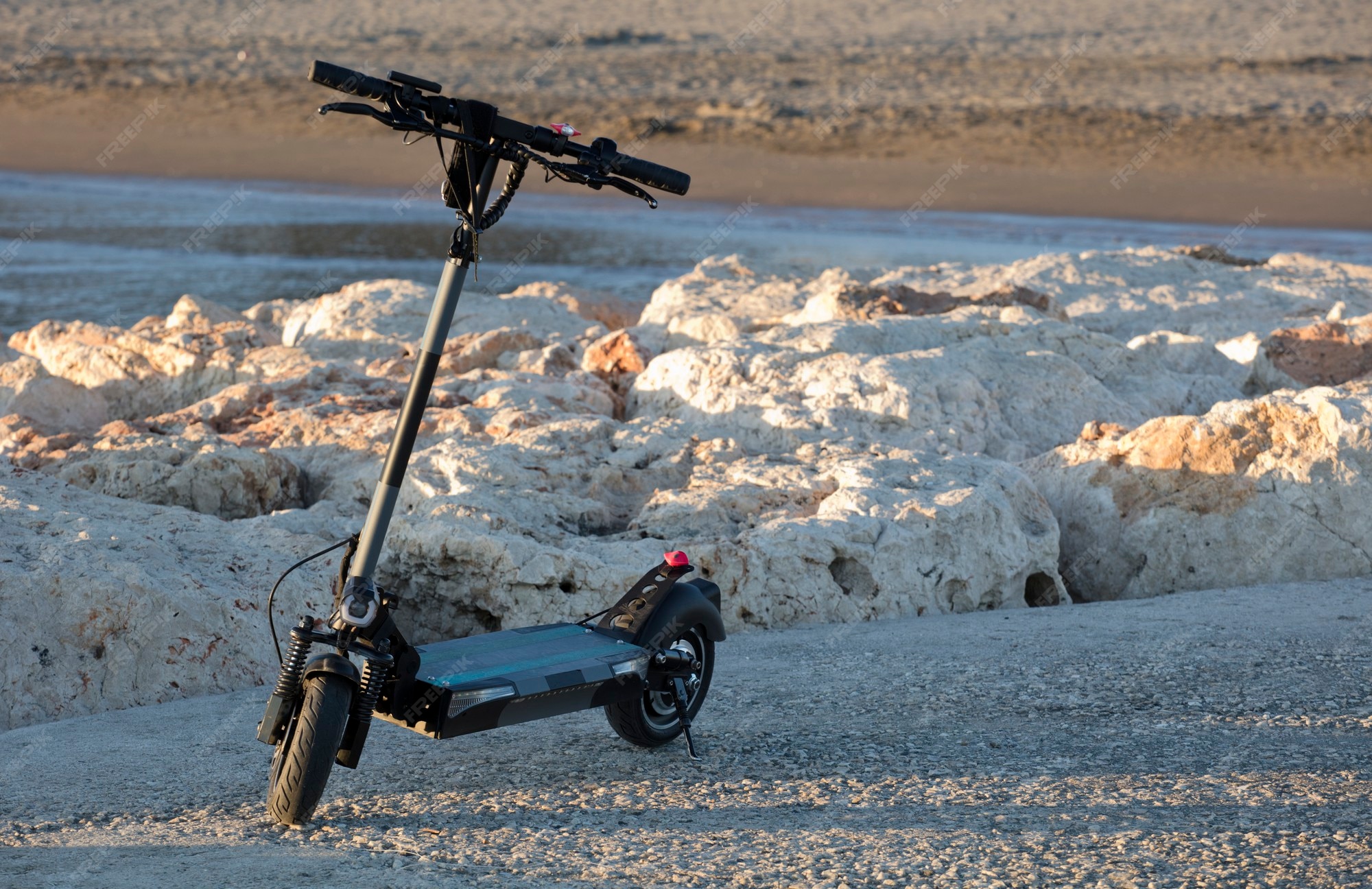 Premium Photo | Electric scooter near the beach at sunset