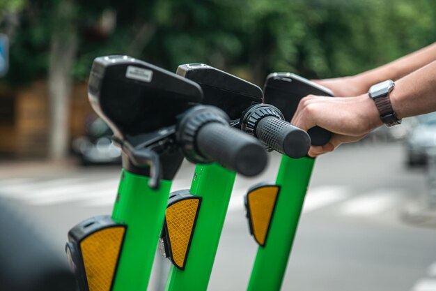 Electric scooters in a city are available for rent close up