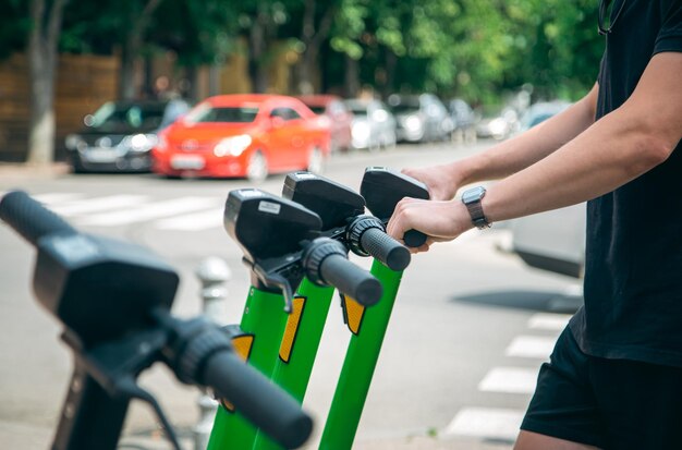 Electric scooters in a city are available for rent close up