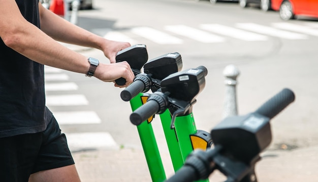 Electric scooters in a city are available for rent close up