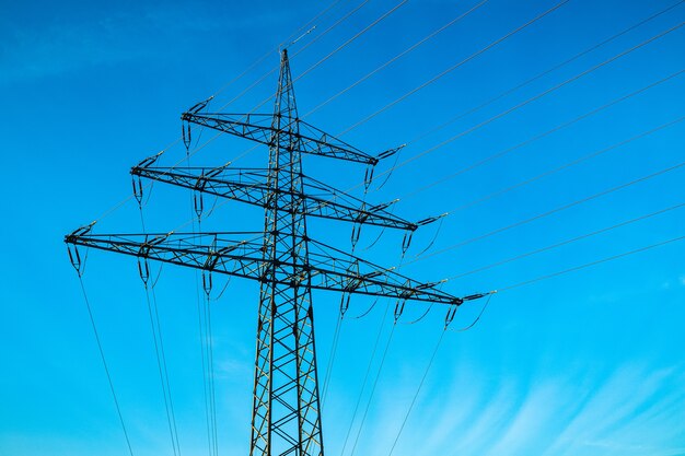 Electrical pole with a blue sky in the background