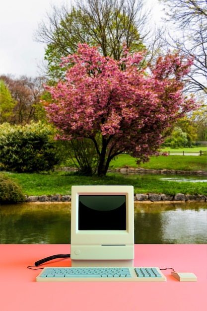 Free photo electronic device surrounded by nature