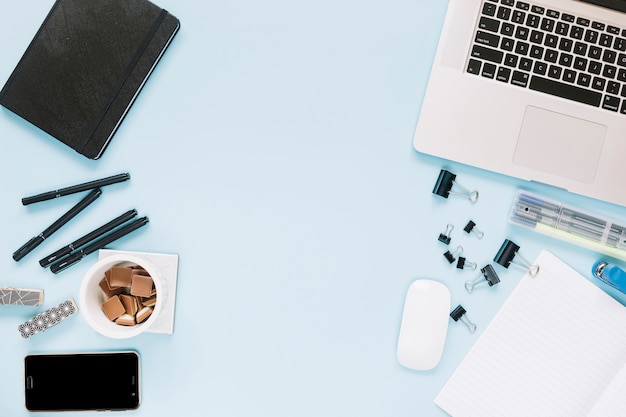 Electronic devices and stationeries on blue backdrop – Free Stock Photo for Download