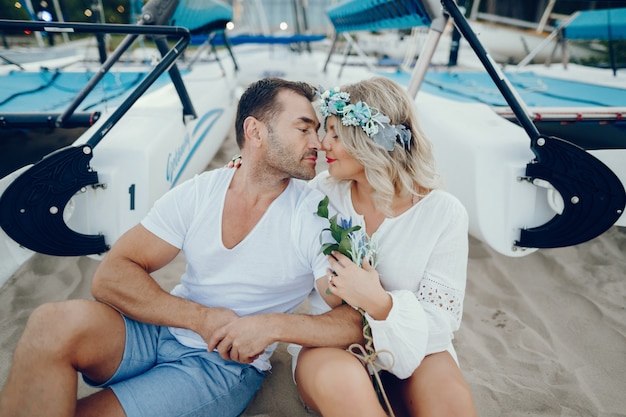 Free photo elegant adult couple on a sand