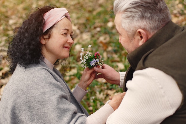 Elegant adult couple in a spring forest