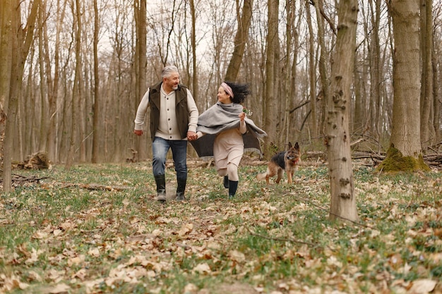 Elegant adult couple in a spring forest