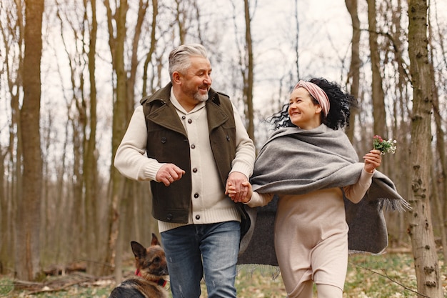 Free photo elegant adult couple in a spring forest