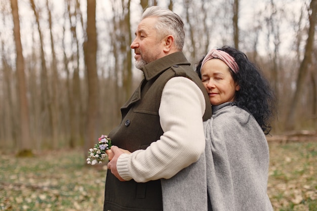 Elegant adult couple in a spring forest