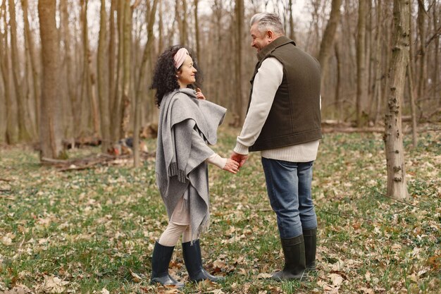 Elegant adult couple in a spring forest