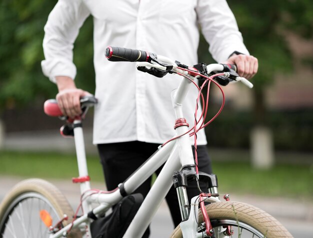 Elegant adult male holding modern bike