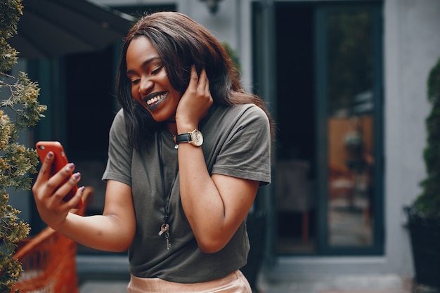 Elegant black girl in a summer city