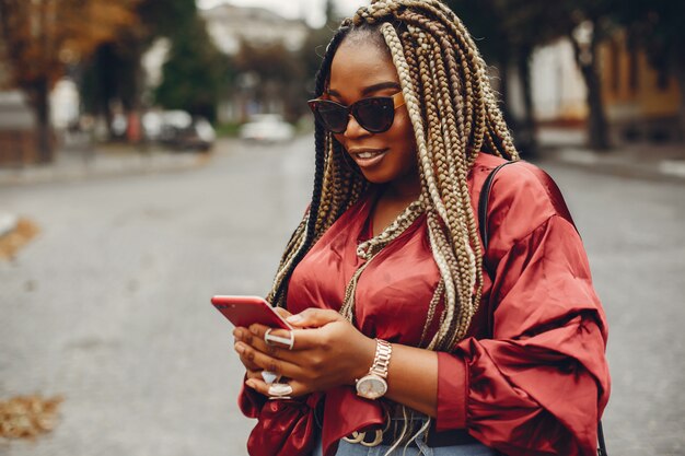 Elegant black girl in a summer city