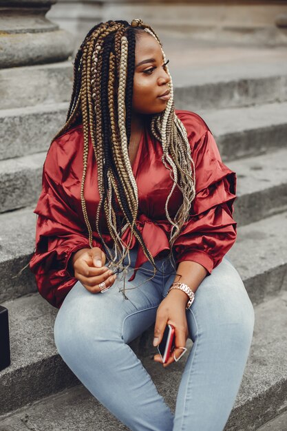 Elegant black girl in a summer city