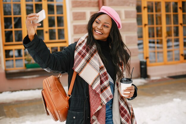 Elegant black girl in a winter city