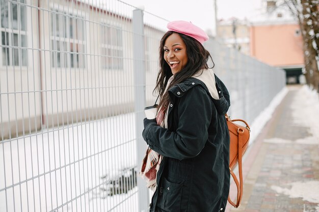 Elegant black girl in a winter city