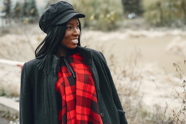 Elegant black girl in a winter park