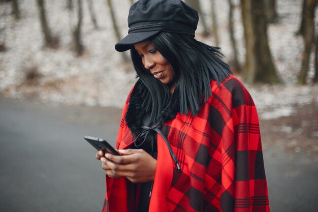 Elegant black girl in a winter park