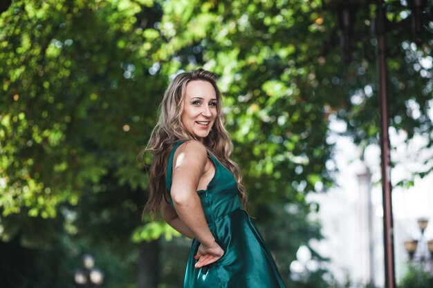 Elegant bridesmaid posing in park