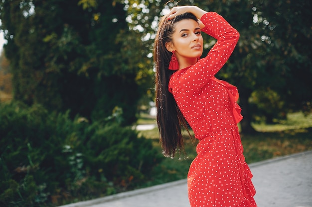 Elegant brunette in a summer city