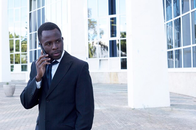 Elegant businessman making phone call