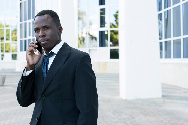 Elegant businessman making phone call