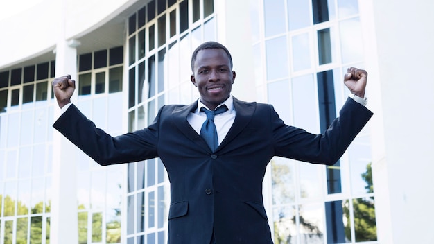 Elegant businessman with victory pose