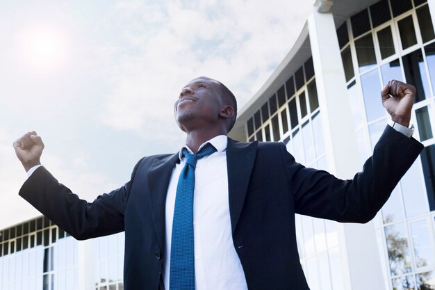 Elegant businessman with victory pose