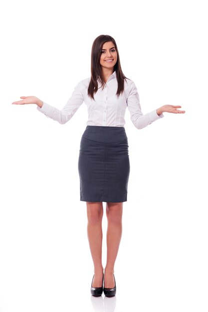 Elegant businesswoman doing welcome gesture