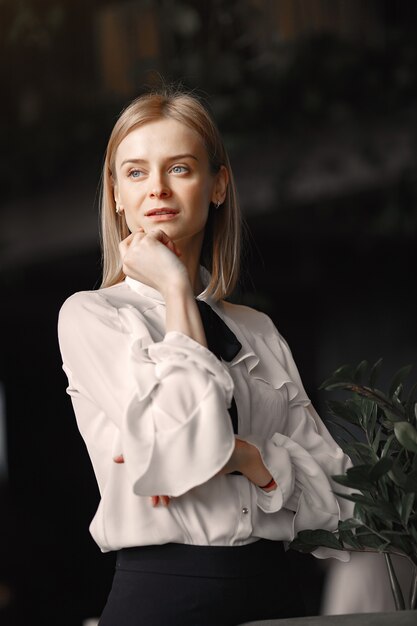 Elegant businesswoman standing in the office