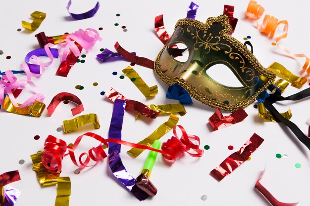 elegant carnival mask on confetti