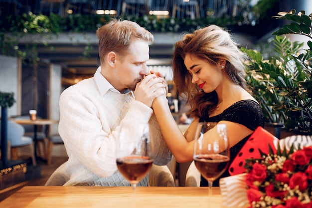 Elegant couple spend time in a restaurant