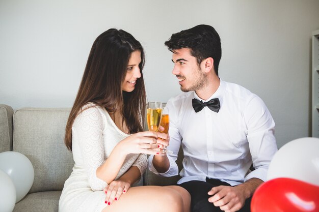 Elegant couple toasting with champelegant couple toasting with champagne glassesagne glasses