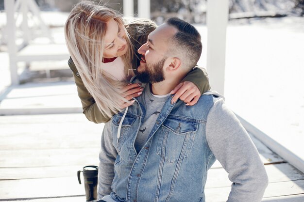 Elegant couple in a winter park