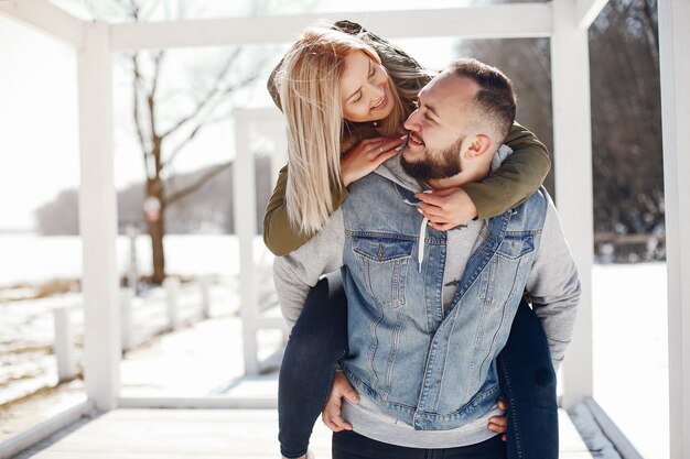 Elegant couple in a winter park