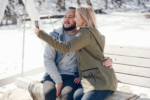 Elegant couple in a winter park