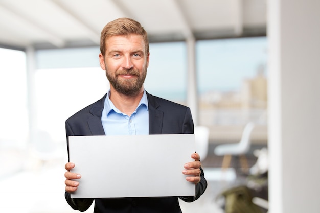 Free photo elegant executive showing a blank signboard