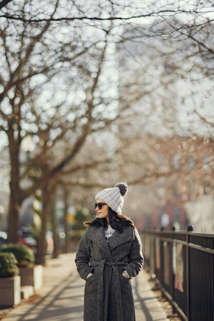 Elegant girl walk in a winter city.