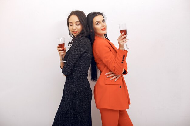 Elegant girls celebrate in the studio