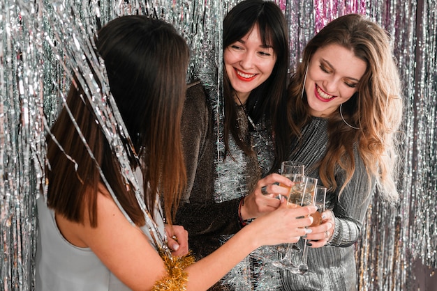 Elegant girls toasting with champagne