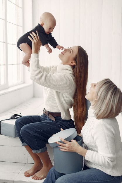 Elegant grandma at home with daughter and granddaughter