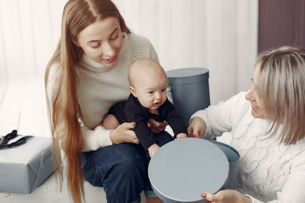 Elegant grandma at home with daughter and granddaughter