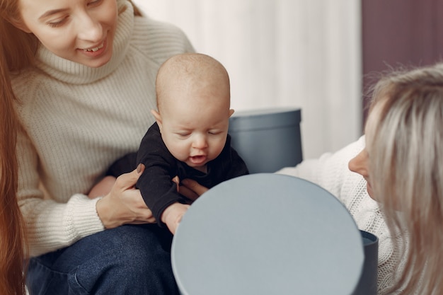 Elegant grandma at home with daughter and granddaughter