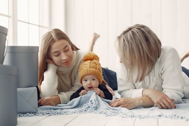 Elegant grandma at home with daughter and grandson