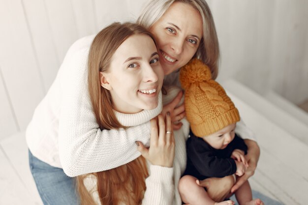 Elegant grandma at home with daughter and grandson