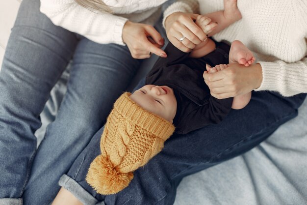 Elegant grandma at home with daughter and grandson