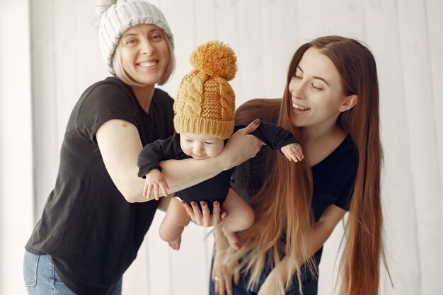 Elegant grandma at home with daughter and grandson