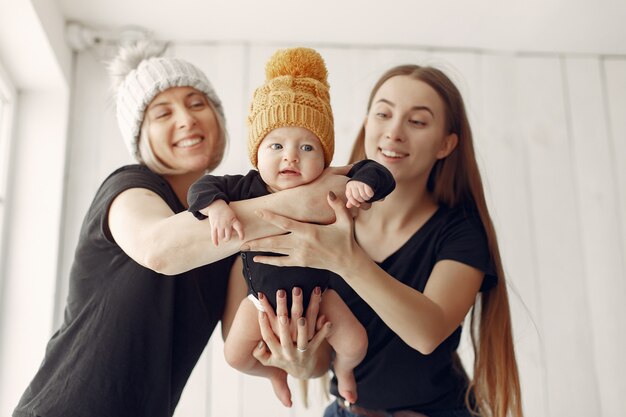 Elegant grandma at home with daughter and grandson